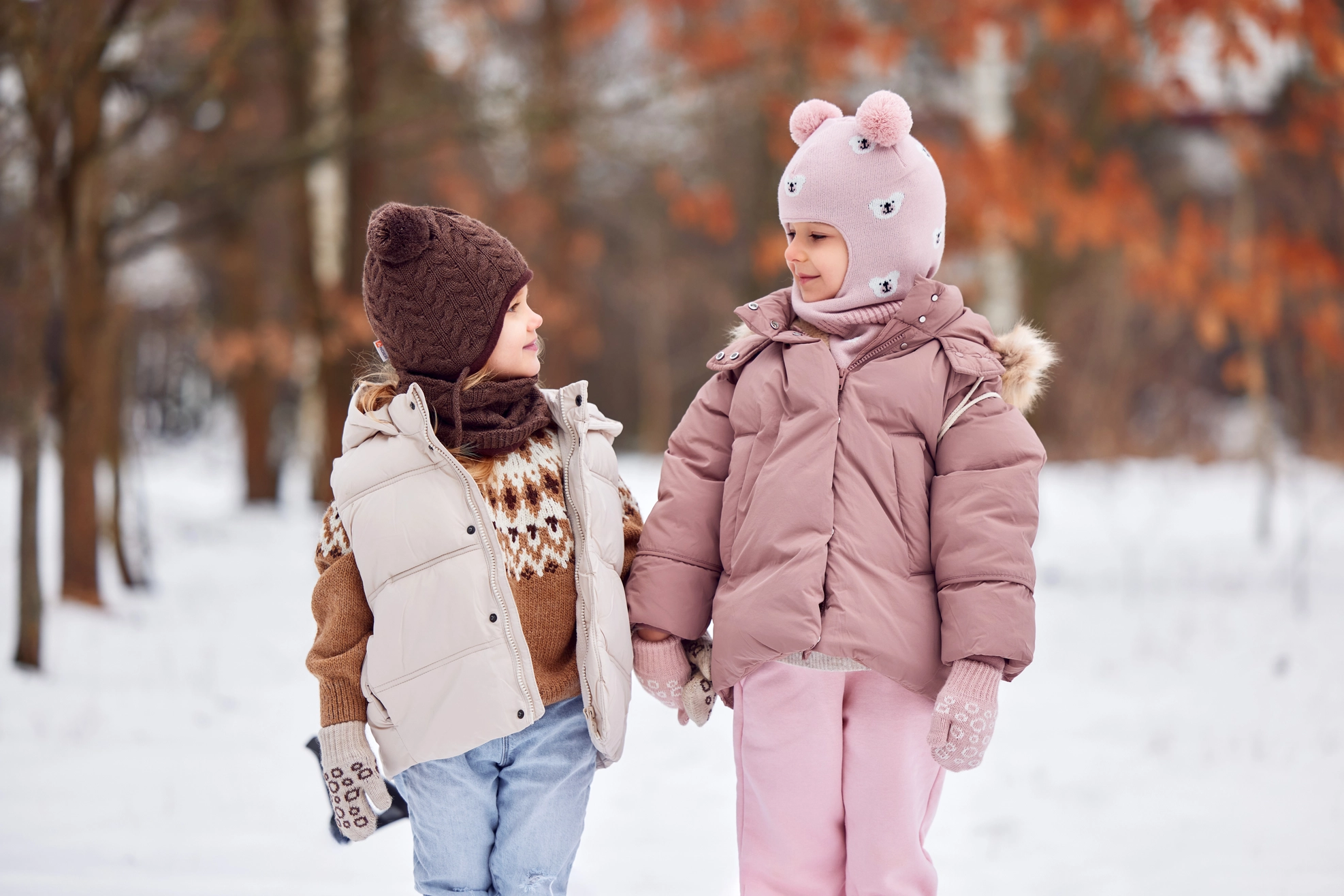 peuter balaclava met pompons en oorbescherming
